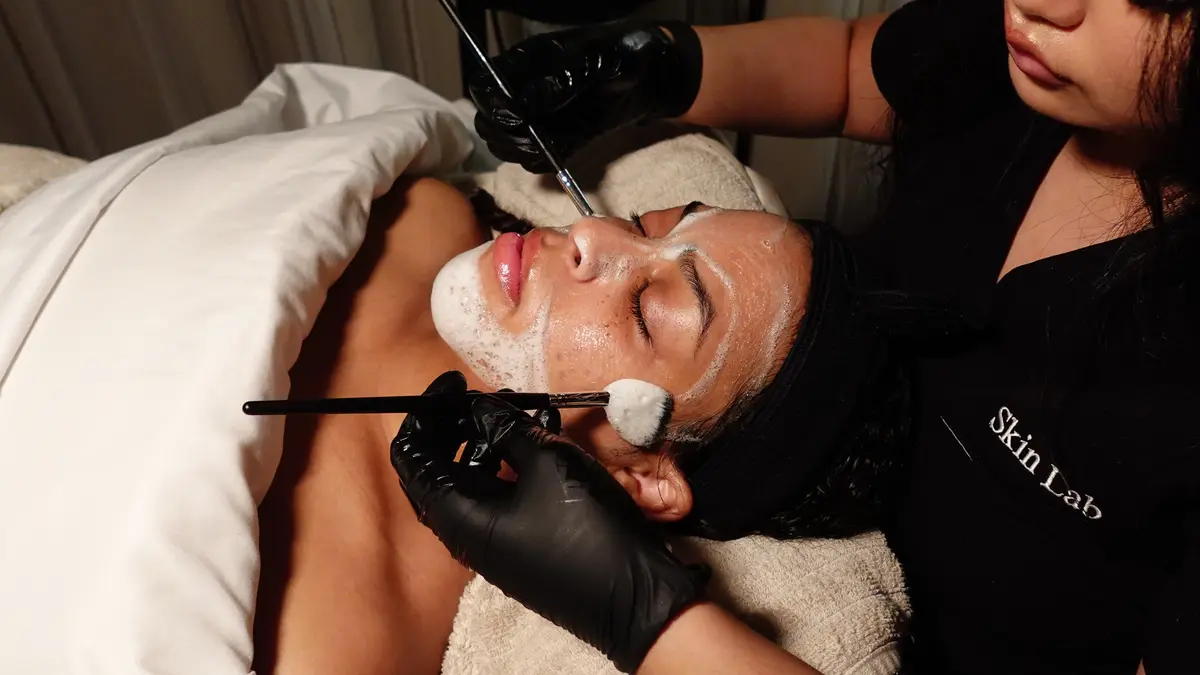 Deep cleanse step of the Luxe Skin Reset Facial with a foaming cleanser and facial cleansing brush