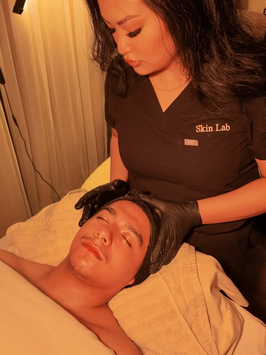 Client relaxing during the finishing steps of a facial at Skin Lab in Memphis